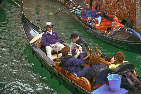 Passengers in a Venetian gondola